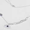 Collar plata combinado con dijes. Ojito 15x7mm . Escarapela 6mm